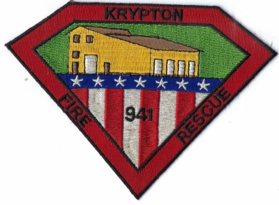 Krypton Fire Rescue (KY)
The building on the front of the patch is the main fire station for Krypton Fire Department.  Unknown when the station was built.
