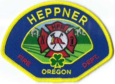 Heppner Fire Department  - Blue (OR)
Heppner FD created 2 patches to be worn year round. The blue/yellow for Class B and Summer clothes.  The Red/Black for the winter uniform clothing.  Once called Standsbury Flatshere, Irish immigrants moved here (19th c) for grazing lands.
