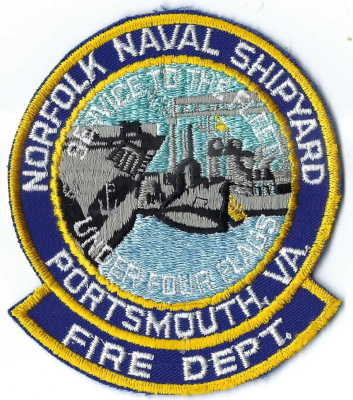 Norfolk Naval Shipyard Fire Department (VA)
"Service to the fleet under four flags" references the long, continuous history of the Norfolk Naval Shipyard.  Established in 1767 as the Gosport Shipyard, it predates the U.S. Navy itself. 
